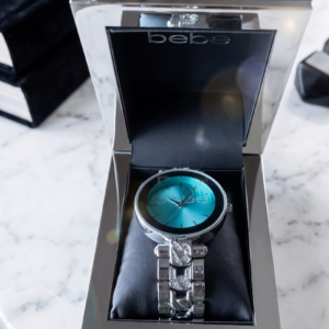 Bebe Women's Crystal-Accented Silver-Tone Link Watch with Vibrant Teal Sunray Dial